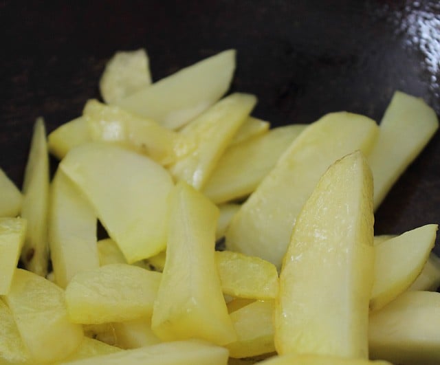 potatoes being sautéed