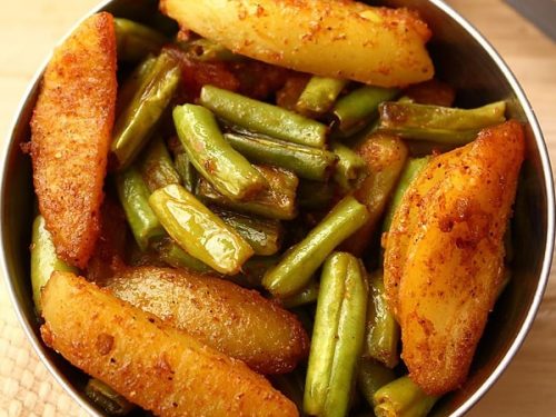 french bean recipe served in a steel bowl.