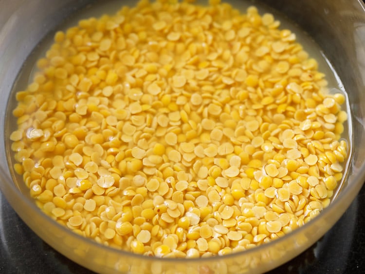 lentils being rinsed in a bowl