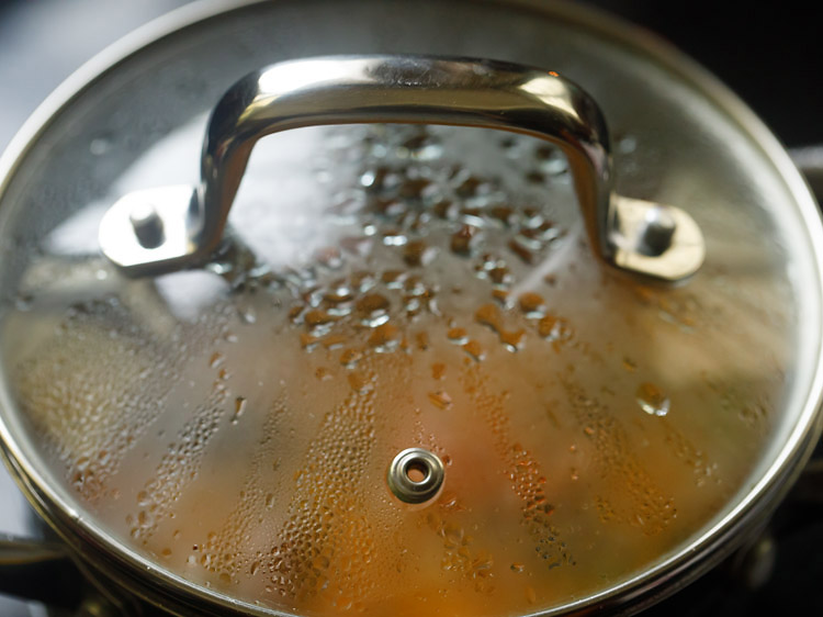 sambar in the pot covered with glass lid