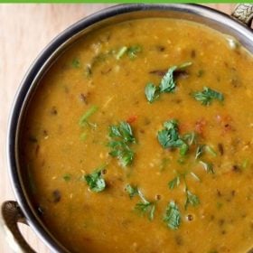 dhaba dal garnished with coriander leaves and served in a kadai.