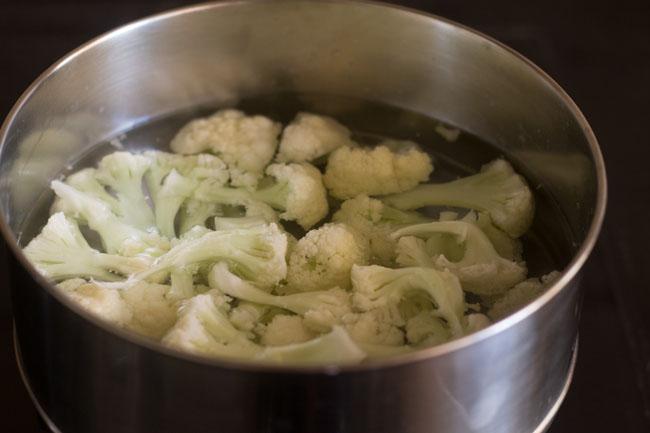 blanching cauliflower florets in the pan