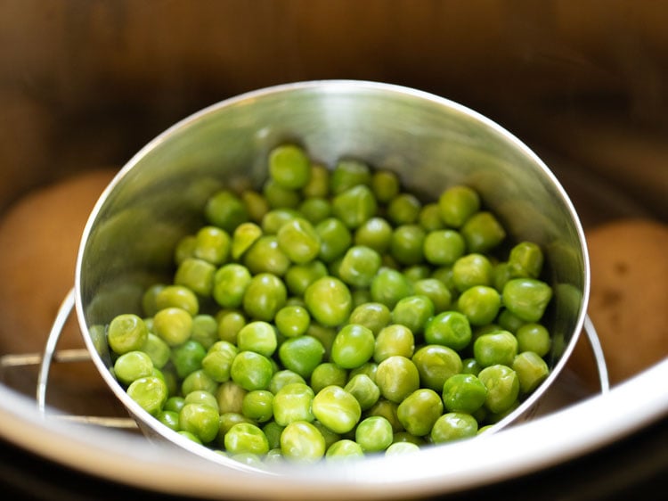 potatoes and green peas after being pressure cooked. 