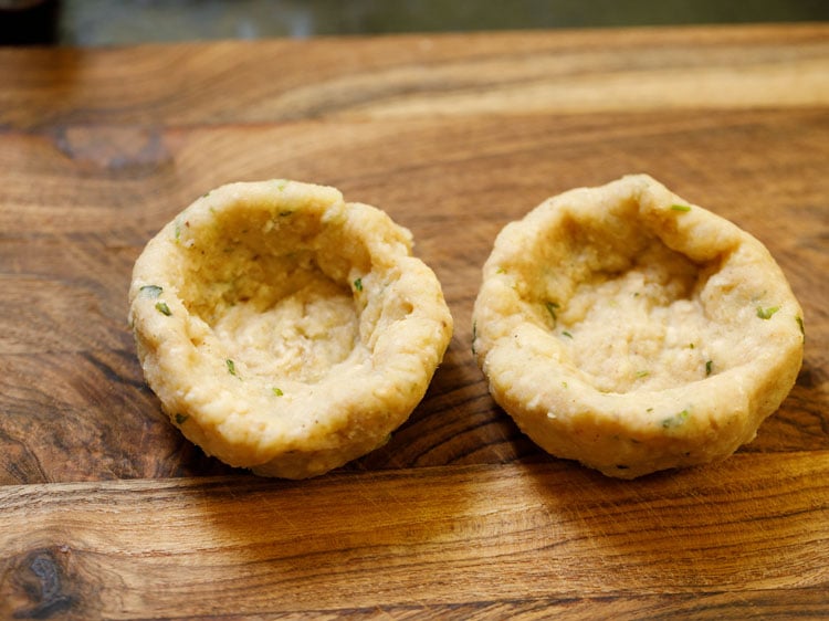 two small cup like discs made from portion of the potato mixture.