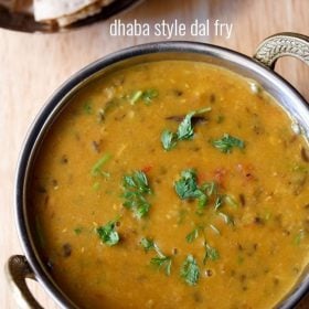 dhaba dal garnished with coriander leaves and served in a kadai with text layover.