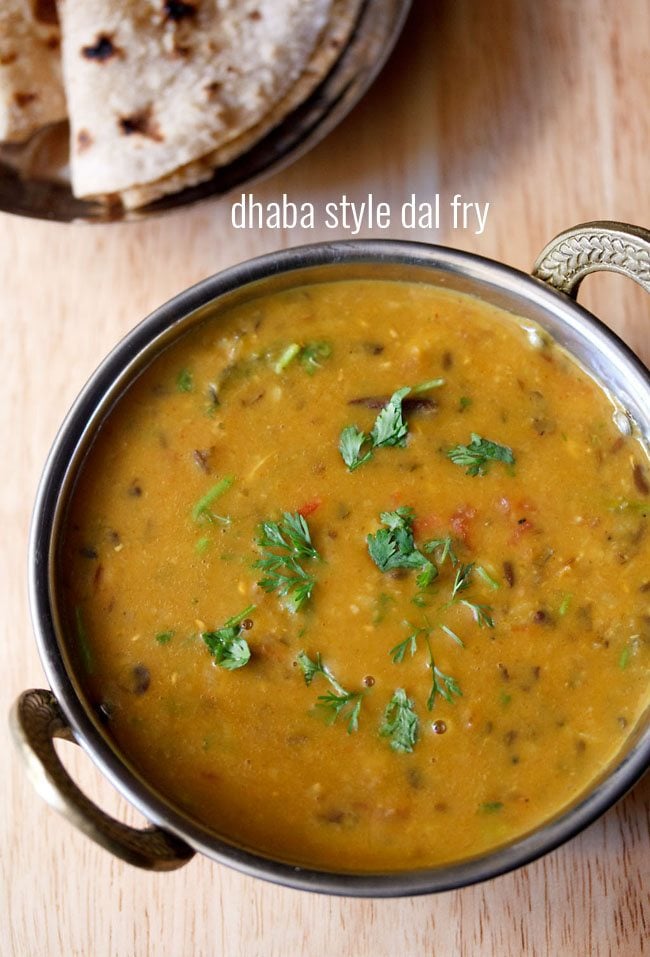 dhaba dal garnished with coriander leaves and served in a kadai with text layover.