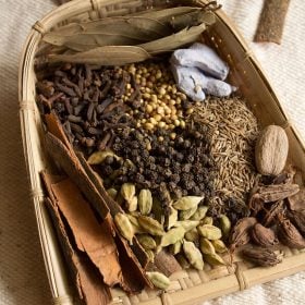 spices kept in a traditional indian basket.