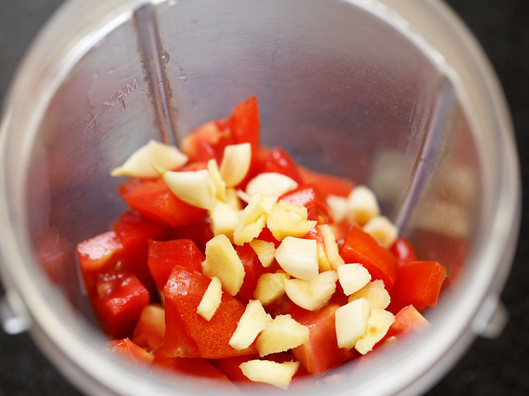 chopped tomatoes, ginger and garlic added in a grinder jar. 