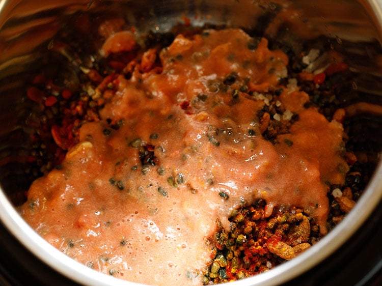 tomato, ginger, garlic puree added on the lentils