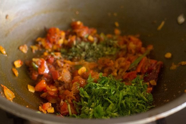 coriander leaves and crushed dry fenugreek leaves in pan