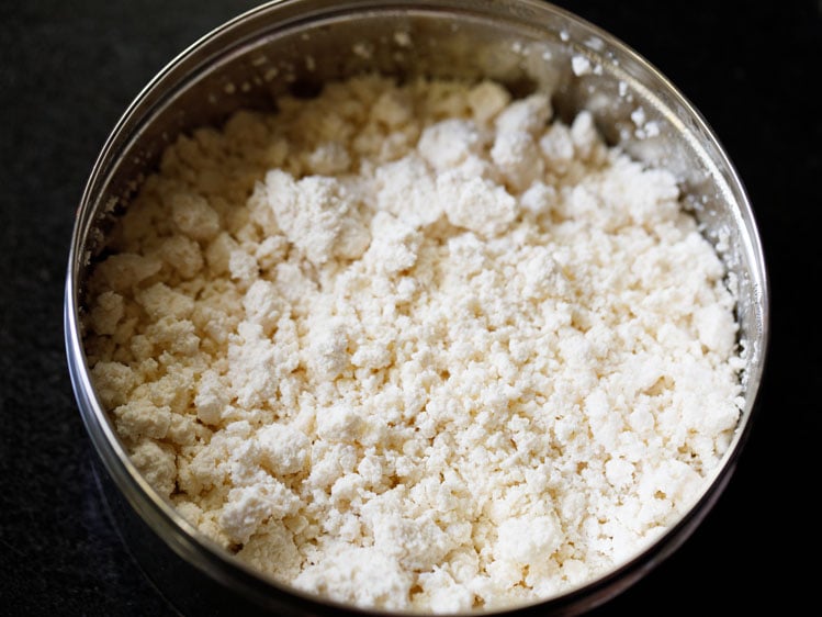 crumbled paneer in a bowl for paneer bhurji recipe. 