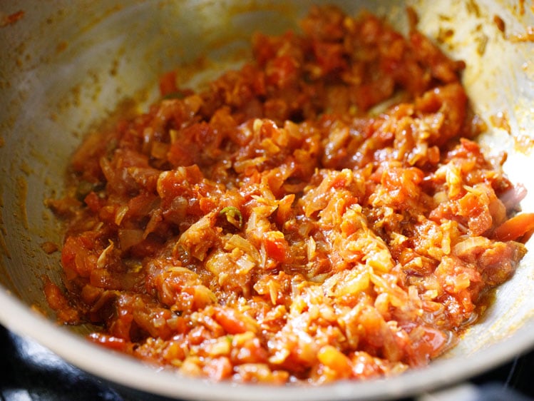 spice powders mixed well in the onion-tomato mixture. 