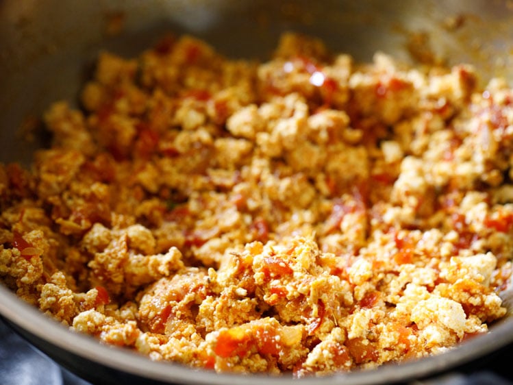 cooking paneer bhurji. 