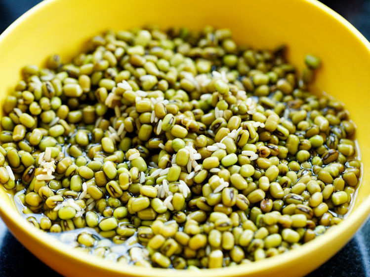 soaked moong beans in a yellow bowl