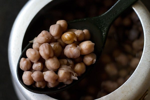 cooked chana (or chole or chickpeas) that have a brown tint from cooking with amla