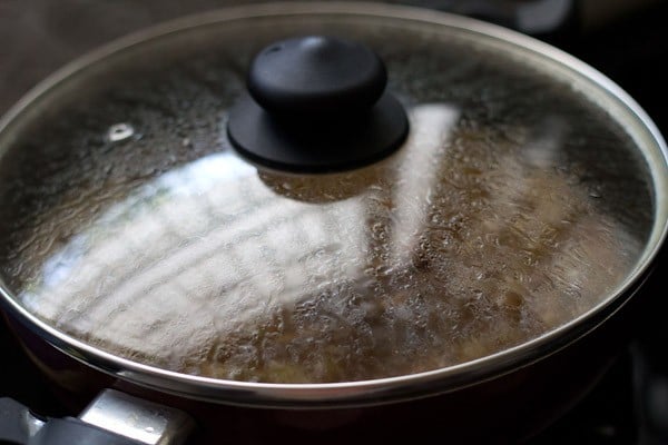 making chole recipe with a lid on for thinner gravy