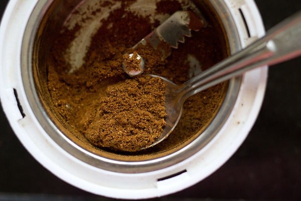 ground chana masala or chole masala powder in a spice grinder