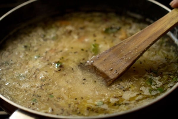 mixing rava with a spatula