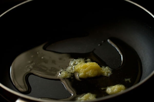 heating ghee in a frying pan