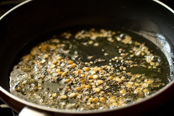 frying lentils to make upma recipe