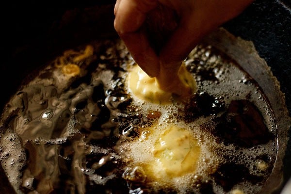 frying vada pav 