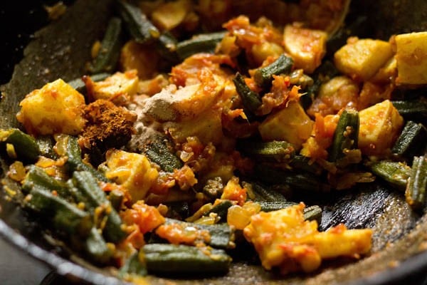 cooking aloo bhindi in the pan