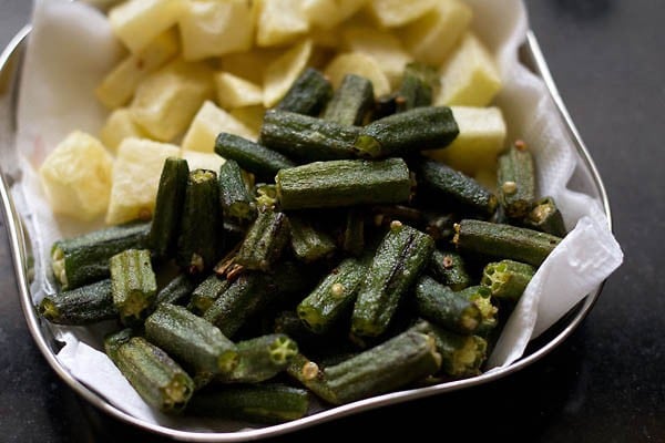 fried okra on paper towels in a plate