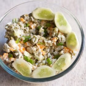 veg russian salad served in a glass bowl.
