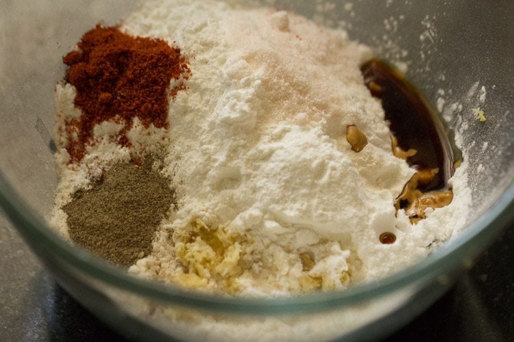 batter ingredients and seasonings in glass bowl