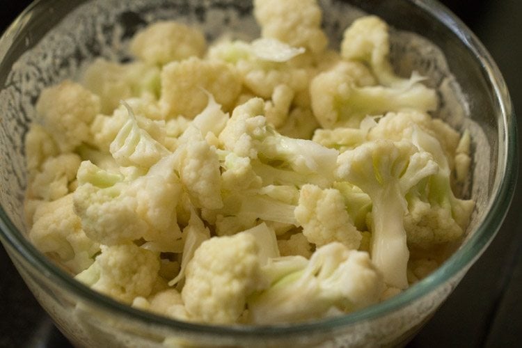 gobi florets added to batter in bowl