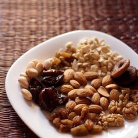 dry fruits and nuts on a white plate.