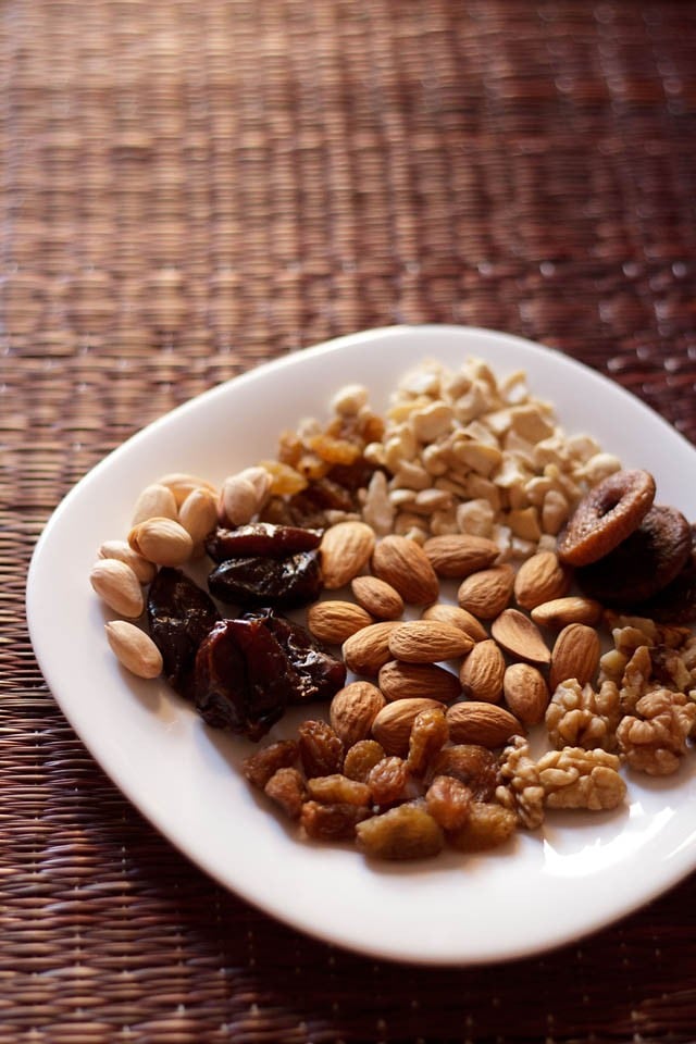 dry fruits and nuts on a white plate.
