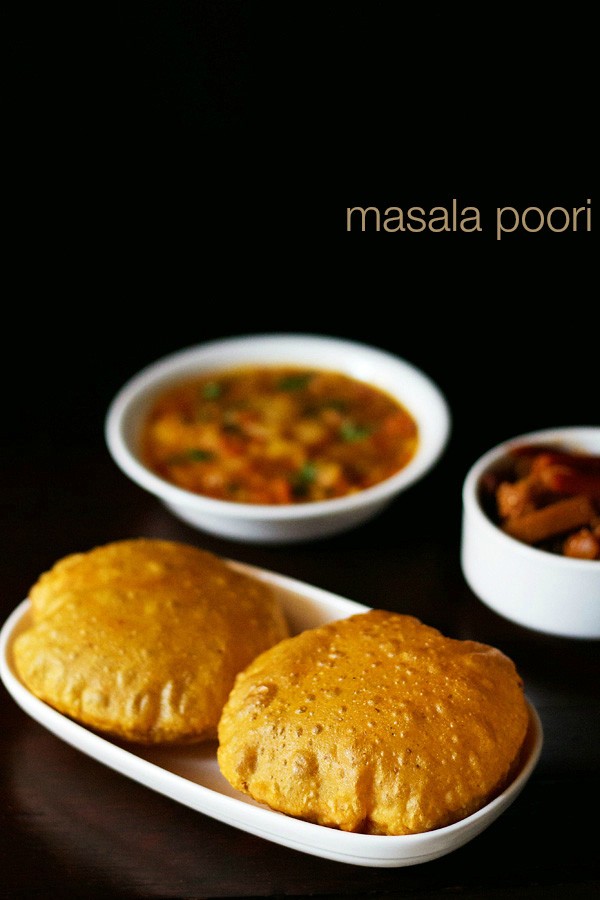 masala poori served in a plate with a side of potato curry and pickle