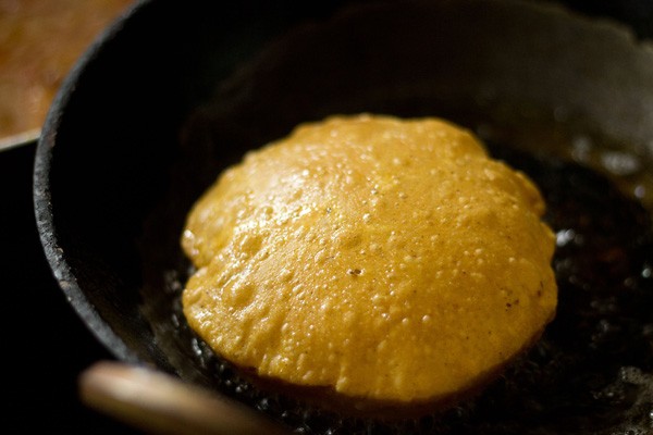 frying masala pooris in oil