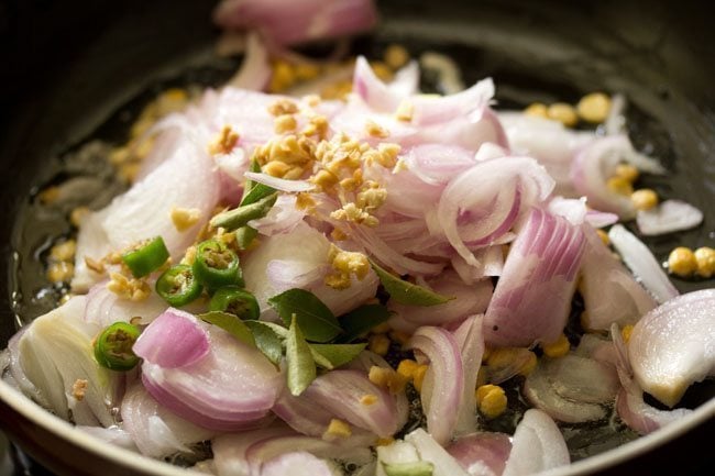 adding onions curry leaves ginger chillies