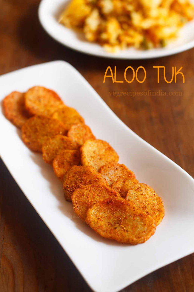 aloo tuk served on a white plate with text layover.