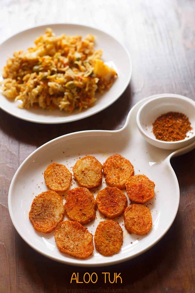 aloo tuk served on a white plate with dry chutney