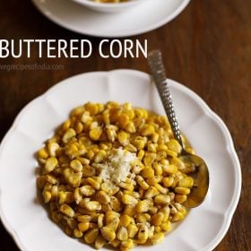 buttered corn served in a white plate