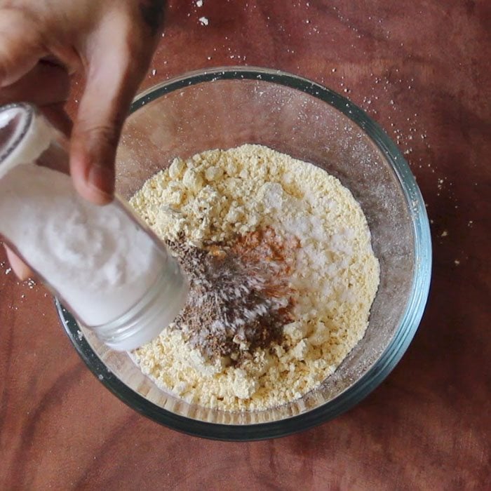 adding salt to gram flour and spices
