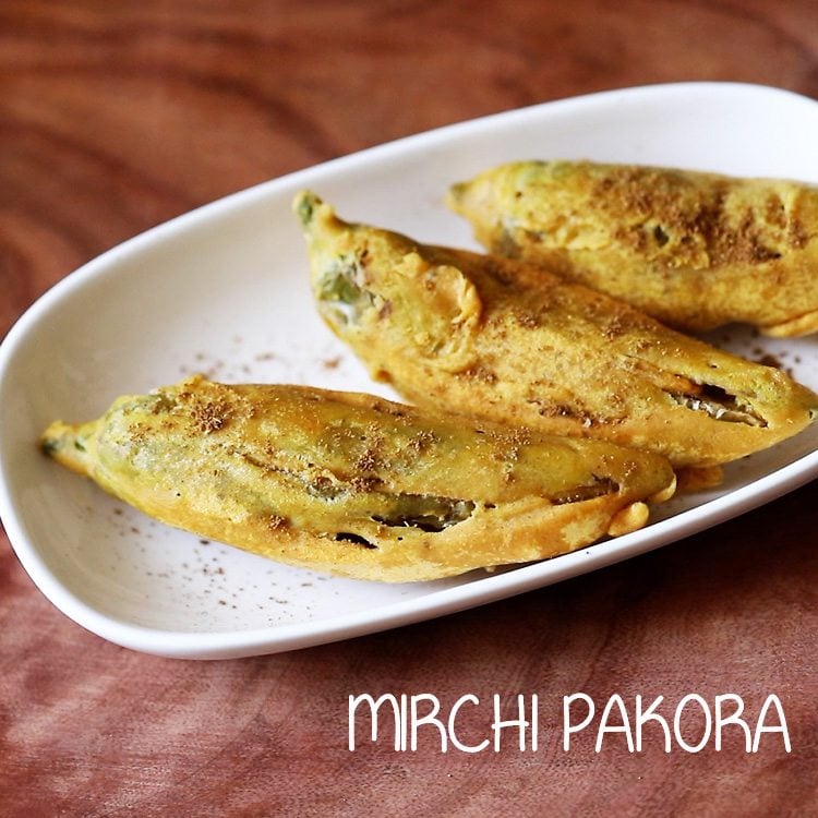 mirchi pakora served in a white plate