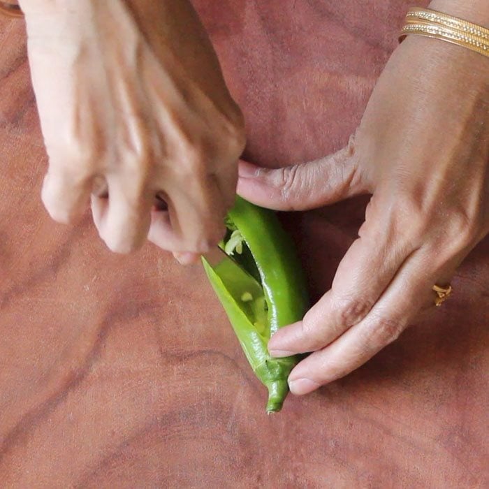 remove the seeds and pith with a small spoon from chilies