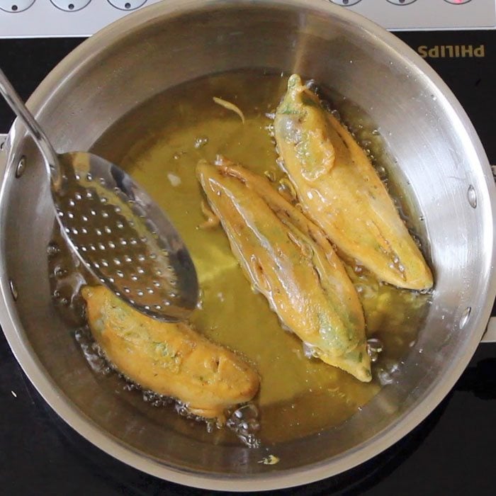 frying and turning chilies a couple of times