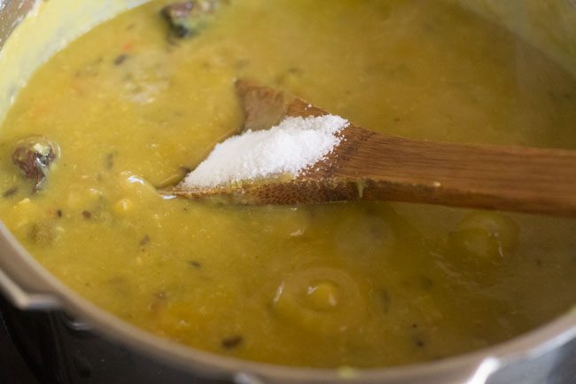 adding salt to panchmel dal