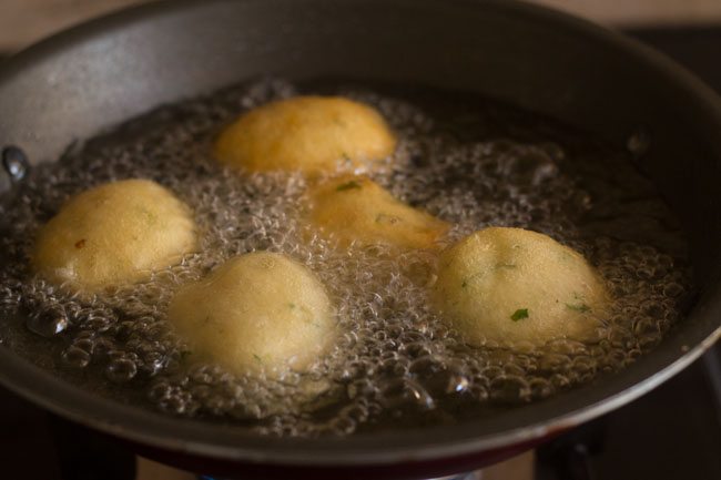frying mix dal vada in hot oil. 