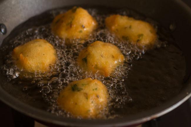 frying mix dal vada in hot oil till crisp and golden. 