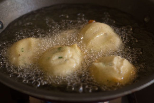 frying more mix dal vadas in hot oil. 