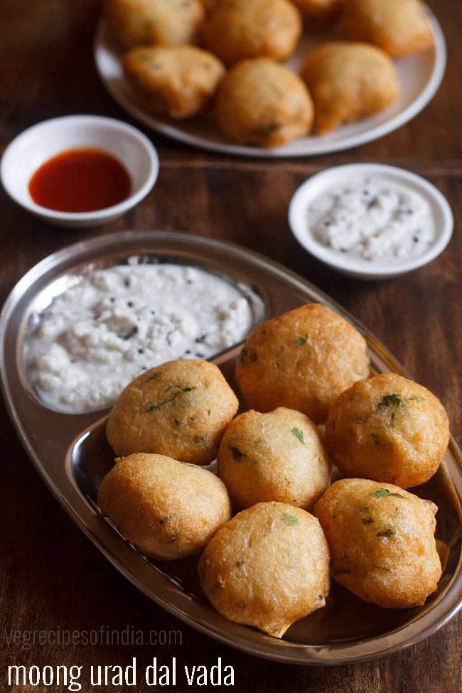 mix dal vada served on a steel plate with coconut chutney and text layover.