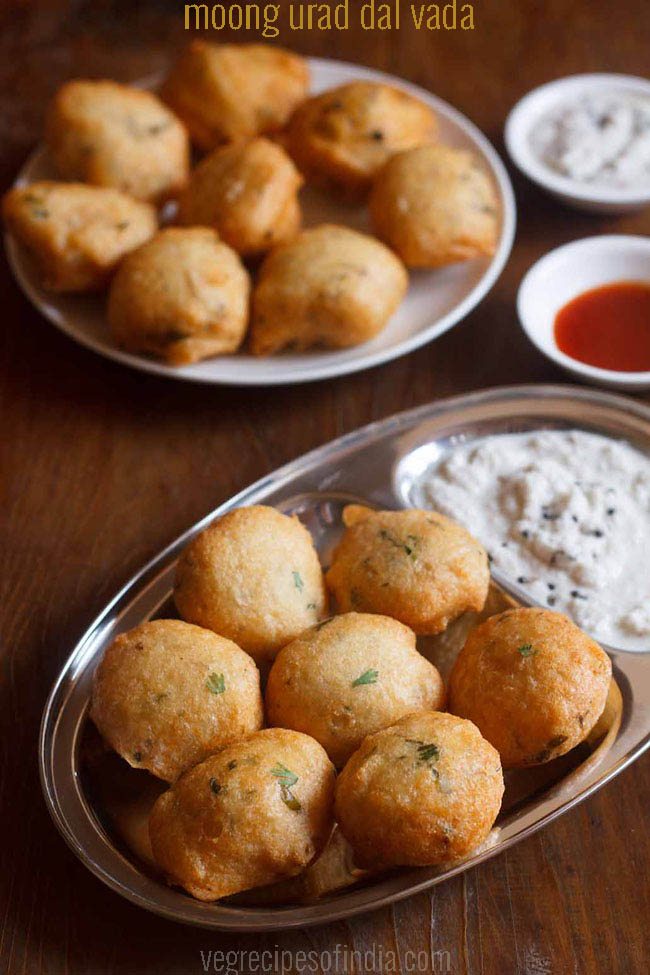 mix dal vada served on a steel plate with coconut chutney and text layover. 
