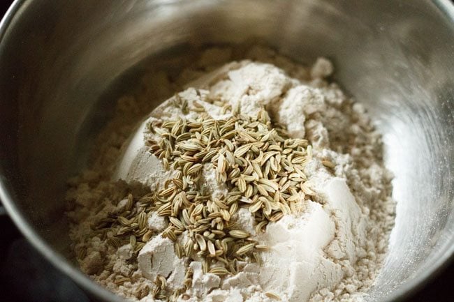 whole wheat flour and fennel seeds in a bowl