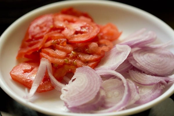sliced onions and tomatoes in a plate